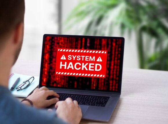 System,hacked,red,alert,on,computer,laptop,screen.,warning,message